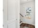 Bright entryway with hardwood floors, white trim, and a view of the front exterior at 8210 Sonata Ln, Cumming, GA 30041