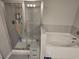 Bathroom featuring a walk-in shower with glass enclosure and separate soaking tub at 2264 Shetley Creek Dr, Norcross, GA 30071