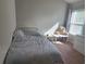 Bedroom with a window letting in light and simple decor, complete with a twin bed at 2264 Shetley Creek Dr, Norcross, GA 30071