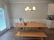 An open dining area that has a modern light fixture and plenty of natural light at 2264 Shetley Creek Dr, Norcross, GA 30071