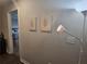 Hallway with artwork and a view into the bedroom at 2264 Shetley Creek Dr, Norcross, GA 30071