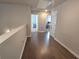 Upstairs hallway with hardwood floors, white trim, and multiple doorways leading to rooms at 2264 Shetley Creek Dr, Norcross, GA 30071