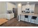 Kitchen with granite countertop island and stainless steel appliances, and modern bar stools at 2264 Shetley Creek Dr, Norcross, GA 30071