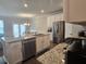 Open kitchen with stainless steel appliances and granite countertops at 2264 Shetley Creek Dr, Norcross, GA 30071