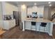 Bright kitchen features stainless steel appliances, granite countertops, and a large island with seating at 2264 Shetley Creek Dr, Norcross, GA 30071