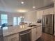 Open kitchen with stainless steel appliances and granite countertops at 2264 Shetley Creek Dr, Norcross, GA 30071