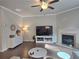 Bright living room with a fireplace, modern furnishings, and hardwood floors at 2264 Shetley Creek Dr, Norcross, GA 30071