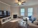 Comfortable living room with fireplace and large windows allowing ample natural light at 2264 Shetley Creek Dr, Norcross, GA 30071