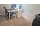Neutral home office with plush carpet, white desk and black office chair at 2264 Shetley Creek Dr, Norcross, GA 30071