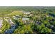Beautiful aerial view of 6715 Pond Rd, near Vickery Village, surrounded by lush greenery and a tranquil pond at 6715 Pond Rd, Cumming, GA 30040