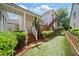 Beautiful backyard with a wooden deck, fenced yard, lush greenery, and a charming play area at 6715 Pond Rd, Cumming, GA 30040