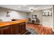 Basement bar area with wooden bar, tile flooring, a dart board, and plenty of lighting at 6715 Pond Rd, Cumming, GA 30040