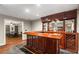 Finished basement with a custom-built wet bar, wine rack, and game area with ping pong table at 6715 Pond Rd, Cumming, GA 30040