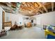 Unfinished basement with exposed ceiling beams, offering ample space for customization and storage at 6715 Pond Rd, Cumming, GA 30040