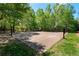 Community basketball court with multiple hoops surrounded by lush trees at 6715 Pond Rd, Cumming, GA 30040