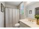 Bathroom with shower-tub combination, white vanity with granite countertop, and decorative mirror at 6715 Pond Rd, Cumming, GA 30040