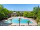 Large community pool with tropical palm trees and comfortable lounge chairs, ideal for summer relaxation at 6715 Pond Rd, Cumming, GA 30040