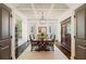 Formal dining room with coffered ceiling, hardwood floors, and traditional wood furniture at 6715 Pond Rd, Cumming, GA 30040