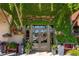 Inviting storefront entrance with lush greenery and colorful floral displays, creating a warm and welcoming atmosphere at 6715 Pond Rd, Cumming, GA 30040