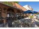 Patio view with outdoor seating under umbrellas and shade, creating a relaxing and inviting dining space at 6715 Pond Rd, Cumming, GA 30040