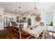 Open kitchen with stainless appliances, large island and dining area at 6715 Pond Rd, Cumming, GA 30040