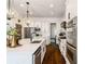 Gourmet kitchen with stainless steel appliances, custom cabinetry, and sleek countertops at 6715 Pond Rd, Cumming, GA 30040