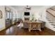 Elegant living room with fireplace, hardwood floors, and seamless transition to screened porch at 6715 Pond Rd, Cumming, GA 30040