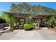 Relaxing outdoor lounge areas with comfortable seating and wooden pergolas surrounded by lush greenery at 6715 Pond Rd, Cumming, GA 30040