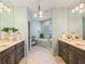 The main bathroom features a double vanity, a large soaking tub, and a glass-enclosed shower at 6715 Pond Rd, Cumming, GA 30040