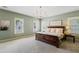 Bright main bedroom with carpet, large windows, and natural light creating a calming atmosphere at 6715 Pond Rd, Cumming, GA 30040