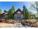 Exterior of a rustic wood office building with inviting entrance and professional landscaping at 6715 Pond Rd, Cumming, GA 30040