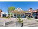 Charming office building exterior with a covered porch and bright blue seating at 6715 Pond Rd, Cumming, GA 30040