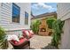 Cozy outdoor patio featuring a stone fireplace and comfortable seating at 6715 Pond Rd, Cumming, GA 30040