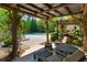 Inviting patio space with comfortable seating, scenic views of the pool, and lush greenery, perfect for relaxation at 6715 Pond Rd, Cumming, GA 30040