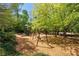 Community playground featuring a slide and swings for outdoor enjoyment at 6715 Pond Rd, Cumming, GA 30040
