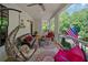 Spacious porch with ample seating, a hanging chair, and a decorative rug perfect for relaxing and entertaining at 6715 Pond Rd, Cumming, GA 30040
