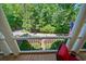 Inviting porch with comfortable seating offering serene views of the surrounding landscape at 6715 Pond Rd, Cumming, GA 30040