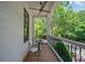 Charming porch featuring outdoor seating, perfect for relaxing and enjoying the serene views of the surrounding nature at 6715 Pond Rd, Cumming, GA 30040