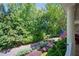 Charming porch featuring comfortable seating and lovely views of the surrounding greenery and street at 6715 Pond Rd, Cumming, GA 30040