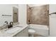 Bathroom featuring granite countertops, tiled walls, and modern fixtures at 101 Mission Se Way # 101, Atlanta, GA 30315