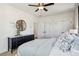 Bright bedroom boasts a stylish black dresser, ceiling fan, and neutral decor at 101 Mission Se Way # 101, Atlanta, GA 30315