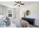 Bedroom with natural light, neutral tones, ceiling fan, and dresser at 101 Mission Se Way # 101, Atlanta, GA 30315