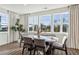 Bright dining room with large windows and modern table and chairs at 101 Mission Se Way # 101, Atlanta, GA 30315