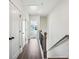 Hallway with hardwood floors and view to a bedroom at 101 Mission Se Way # 101, Atlanta, GA 30315