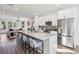 Spacious kitchen with white cabinets, granite counters, stainless appliances, and large central island at 101 Mission Se Way # 101, Atlanta, GA 30315