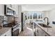 Modern kitchen with granite countertops, stainless steel appliances, and hardwood floors at 101 Mission Se Way # 101, Atlanta, GA 30315