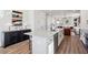Open kitchen with large island, granite countertops, stainless appliances, and view into living area at 101 Mission Se Way # 101, Atlanta, GA 30315