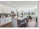 Modern kitchen with stainless appliances, white cabinets, a spacious island, and a dining nook at 101 Mission Se Way # 101, Atlanta, GA 30315