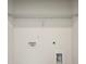 Bright laundry room ready for washer and dryer with wire shelving at 101 Mission Se Way # 101, Atlanta, GA 30315