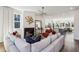 Bright open concept living room next to a chef's kitchen with a fireplace and hardwood floors at 101 Mission Se Way # 101, Atlanta, GA 30315